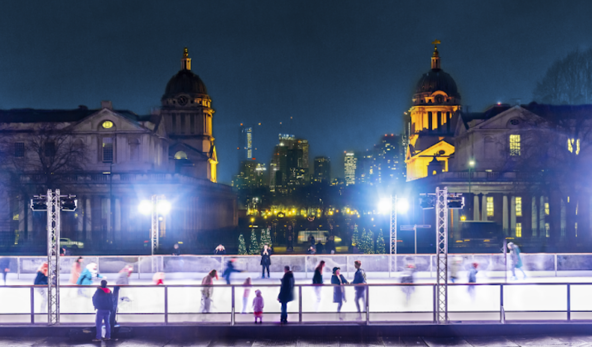 People skating at the Queen's House Ice Rink at night